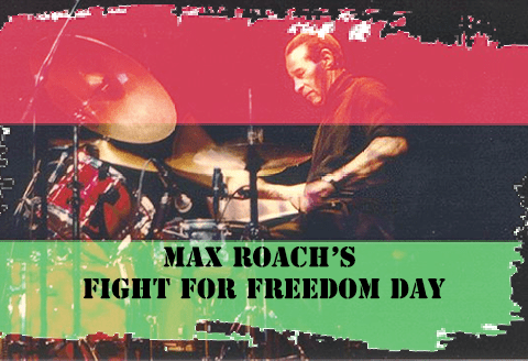 Photo of max roach behind flag fight for freedom day